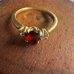 Vintage Tiffany18K Gold  pinky ring Size 3. Has 2 diamonds and a red gem stone